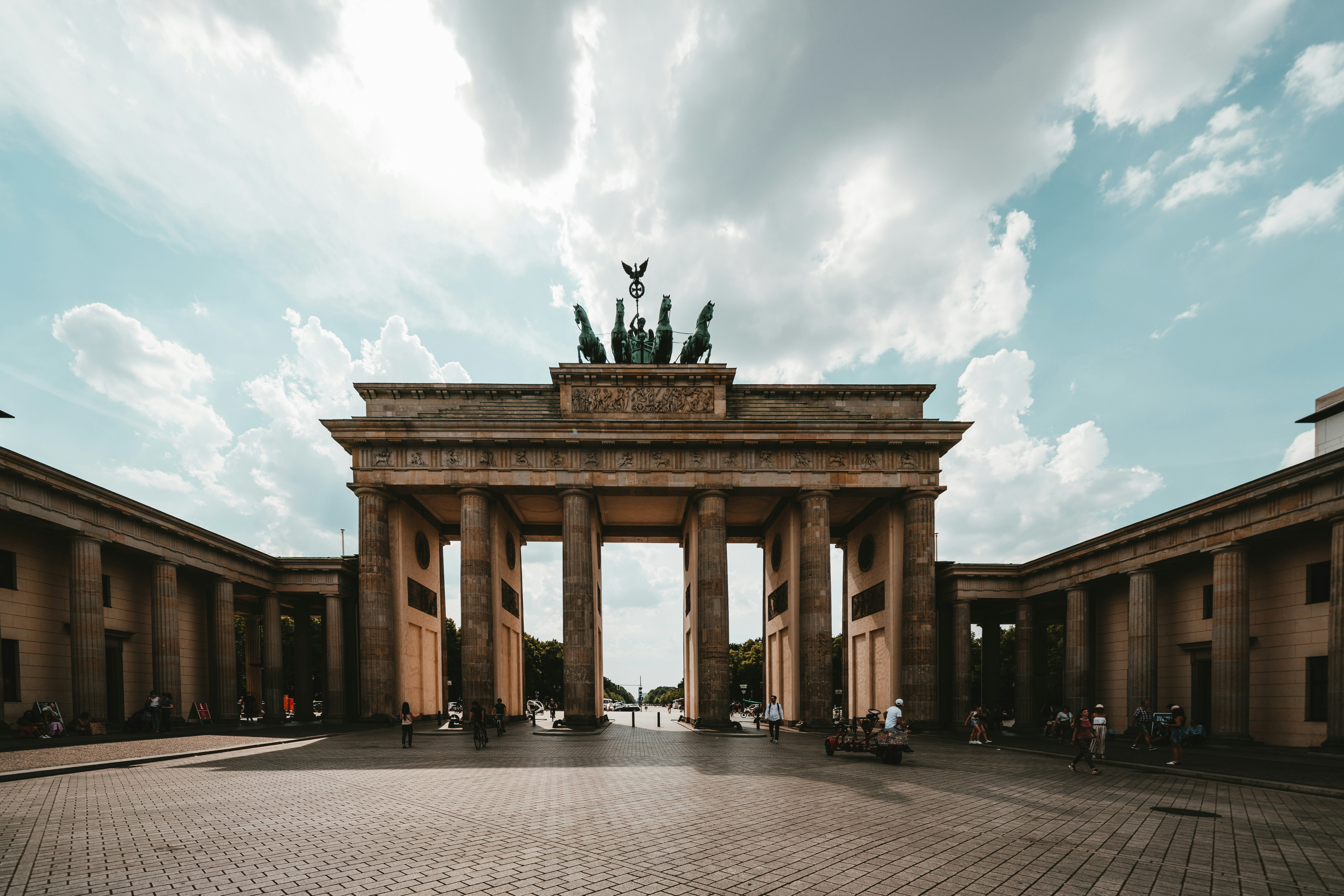 brown concrete gateway under white clouds